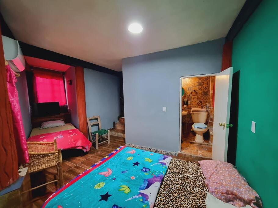 A bed or beds in a room at Hermosa Habitación La Estancia
