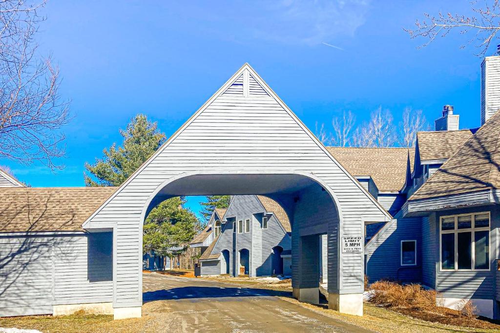 a church with an archway in a residential neighborhood at Alpine Abode in Dover