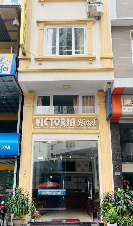 a store front of a victoria hotel with a sign at Victoria hotel in Ha Long
