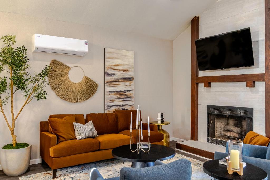 a living room with a couch and a fireplace at Prime Location - 3bd with BBQ in McKinney