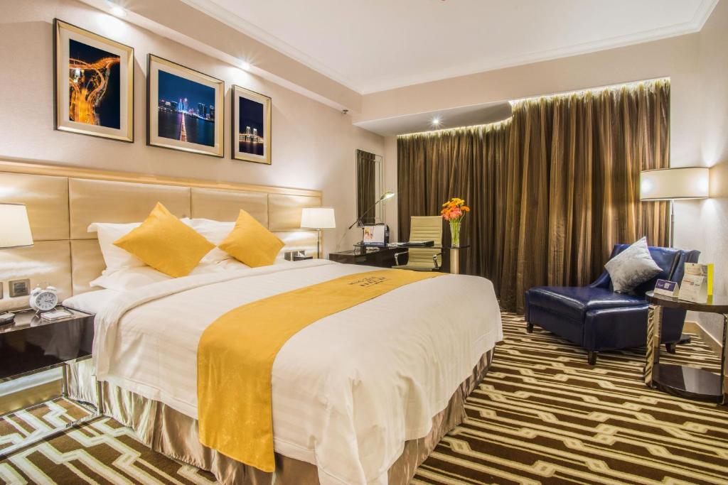 Postel nebo postele na pokoji v ubytování Metropark Hotel Macau