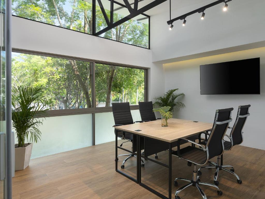 an office with a conference room with a table and chairs at Explorar Koh Phangan - Adults Only Resort and Spa in Haad Rin