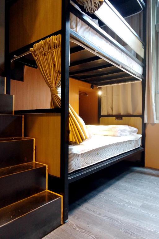 a couple of bunk beds in a room at Angels Hostel Taipei Ximen in Taipei