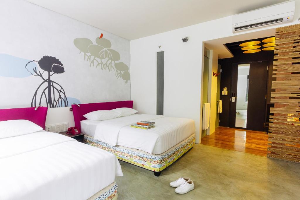 Postel nebo postele na pokoji v ubytování Canvas Boutique Hotel