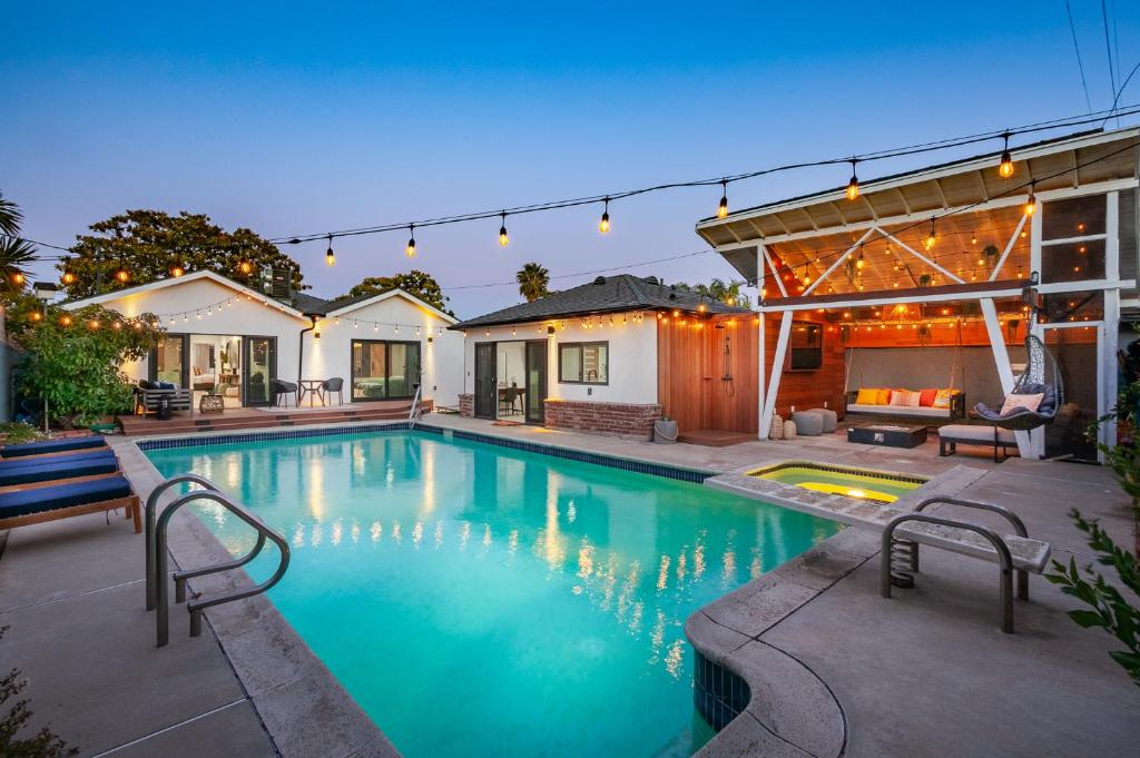 a swimming pool in the backyard of a house at New House with Private Pool, Jacuzzi, Sauna and Cabana in Los Angeles