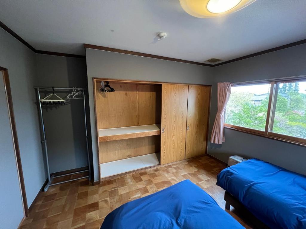 Postel nebo postele na pokoji v ubytování Little Alaskan Guest House