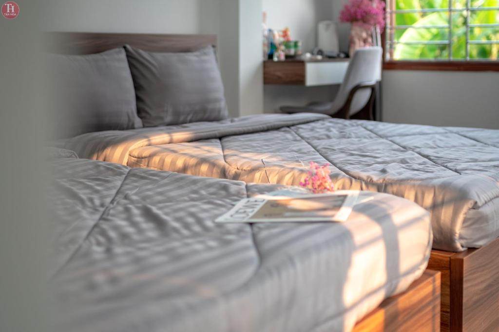 Ein Bett oder Betten in einem Zimmer der Unterkunft Tân Hoà Homestay Da Nang