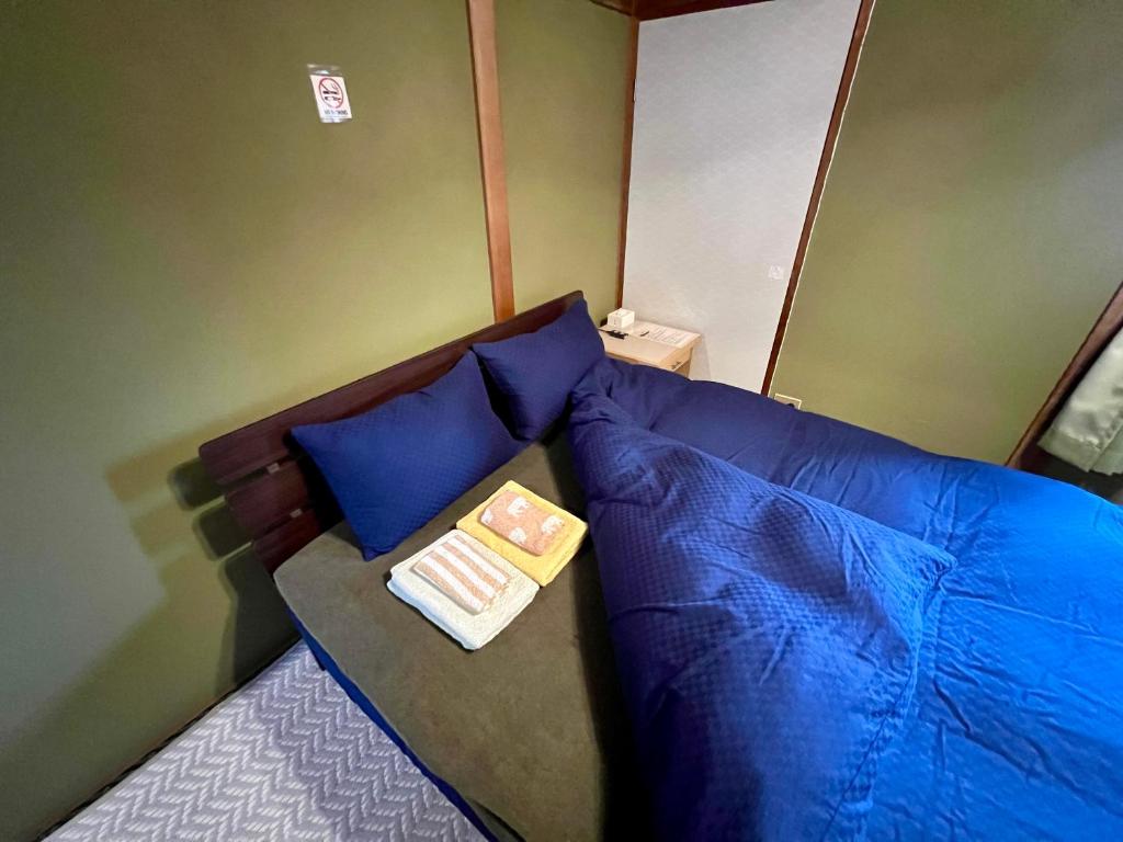 Postel nebo postele na pokoji v ubytování Little Alaskan Guest House