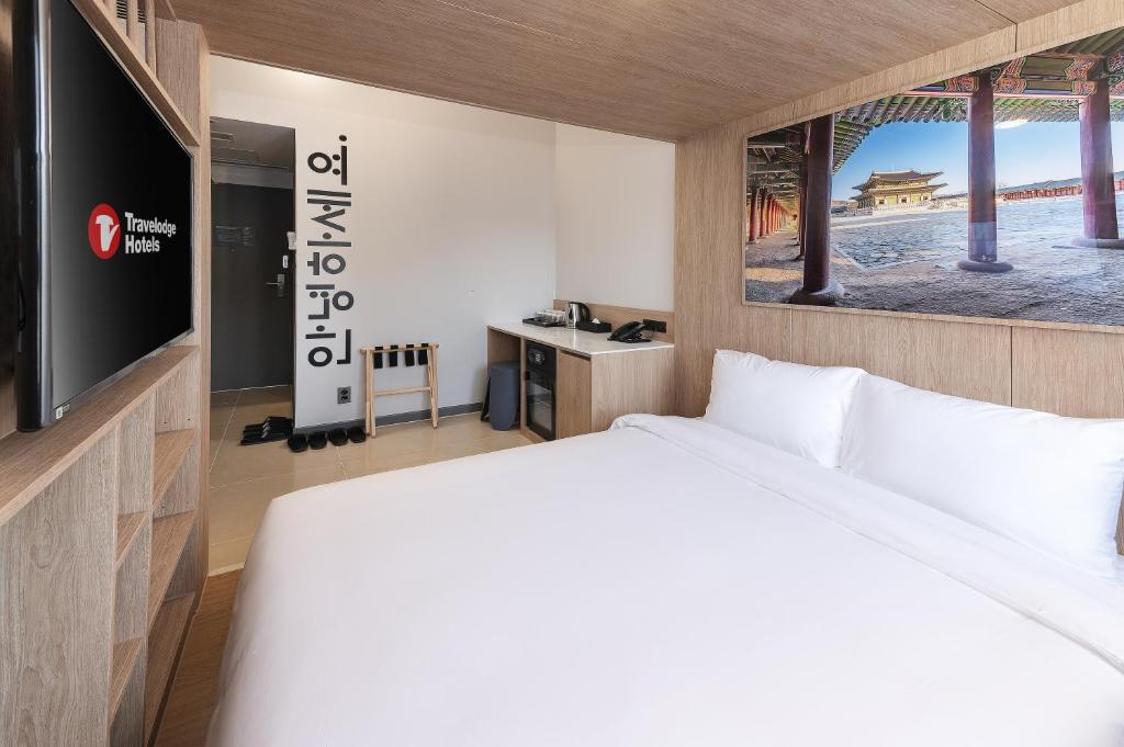Posteľ alebo postele v izbe v ubytovaní Travelodge Myeongdong Namsan