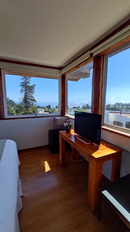 TV a/nebo společenská místnost v ubytování Hotel Green en Marbella