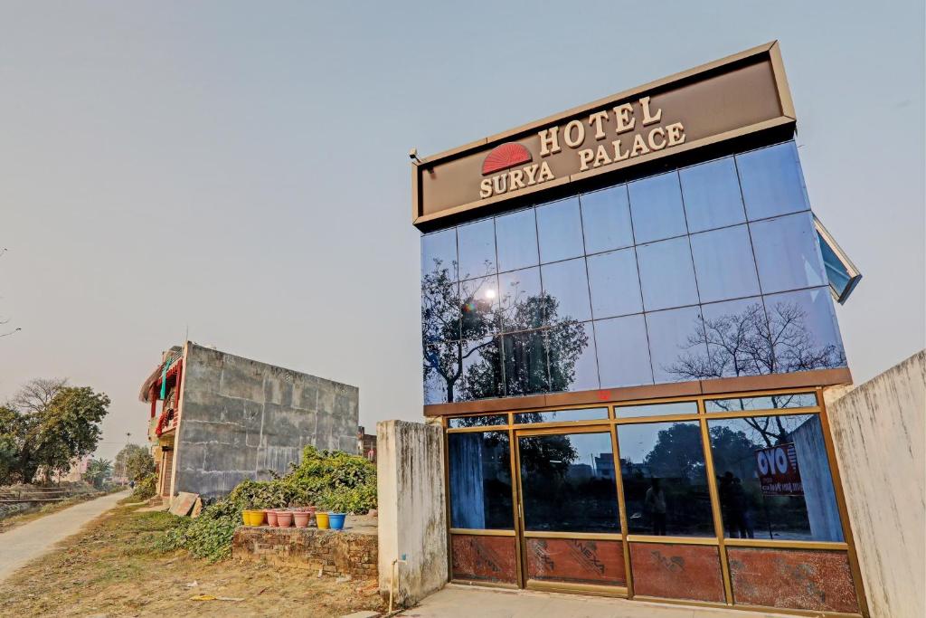 a building with a sign that reads hotel sushi alley at OYO Hotel Surya Palace in Kushinagar