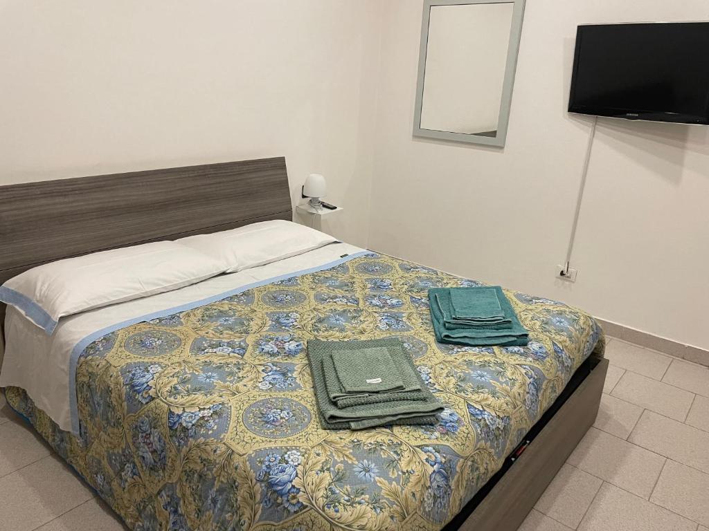 Postel nebo postele na pokoji v ubytování Casa Pompei