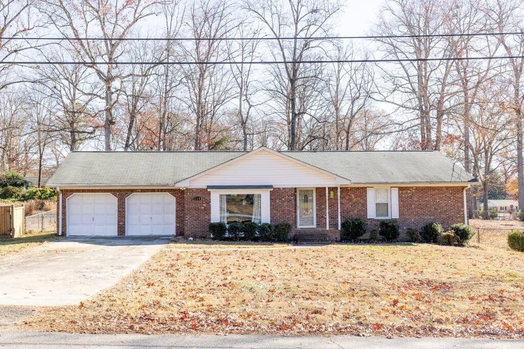 a brick house with a garage at Beautiful Home. W/Hot Tub. Great Location in Taylors