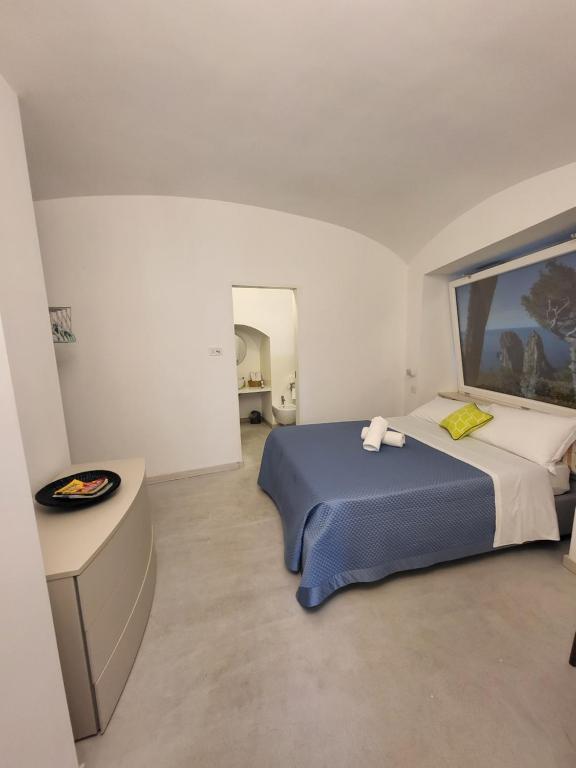 Posteľ alebo postele v izbe v ubytovaní Casa Capri Mores