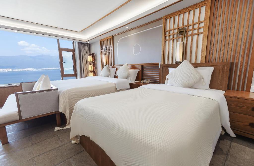 Postel nebo postele na pokoji v ubytování Dali Dare Sea View Gueshouse