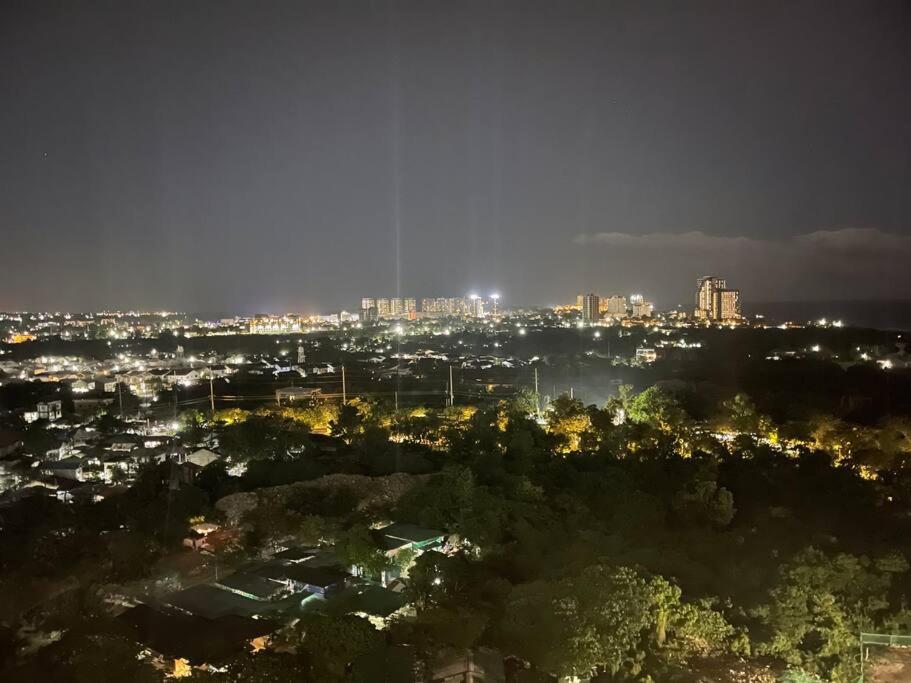 a view of a city at night at Ma Roberta - Tambuli Resort with fast Wifi 16 Floor Studio Type in Lapu Lapu City