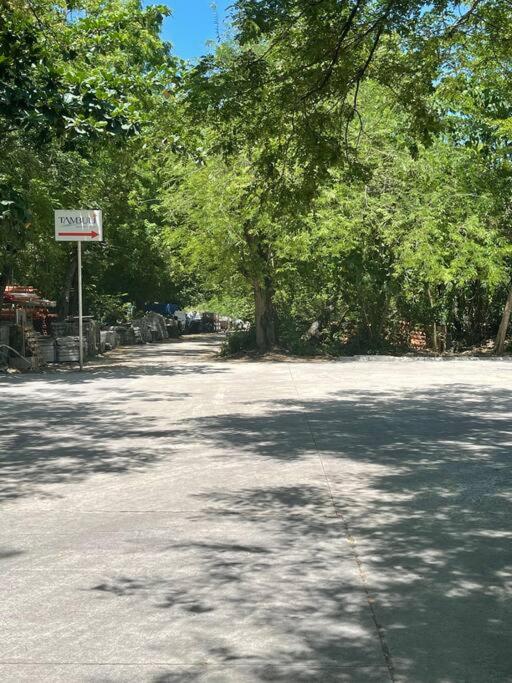 a road with a sign on the side of it at Ma Roberta - Tambuli Resort with fast Wifi 16 Floor Studio Type in Lapu Lapu City