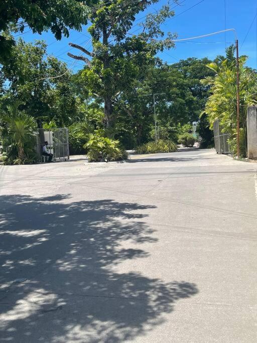 an empty parking lot with trees and a fence at Ma Roberta - Tambuli Resort with fast Wifi 16 Floor Studio Type in Lapu Lapu City