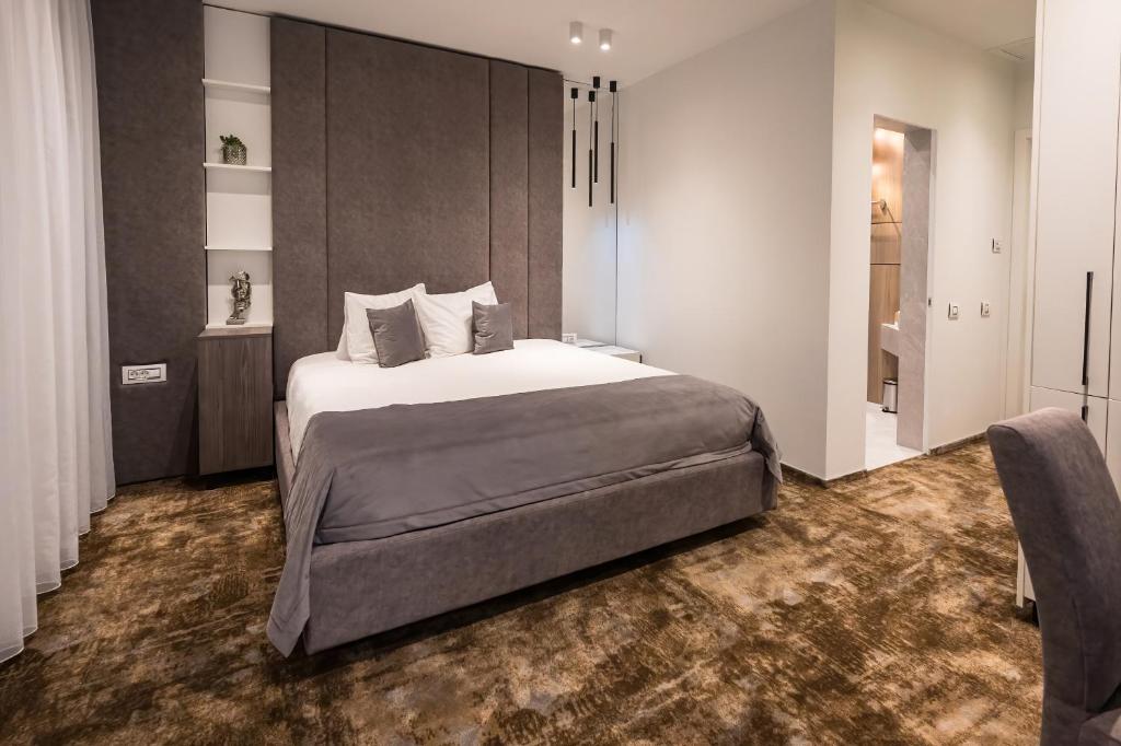 Postel nebo postele na pokoji v ubytování ALIVE HOTEL