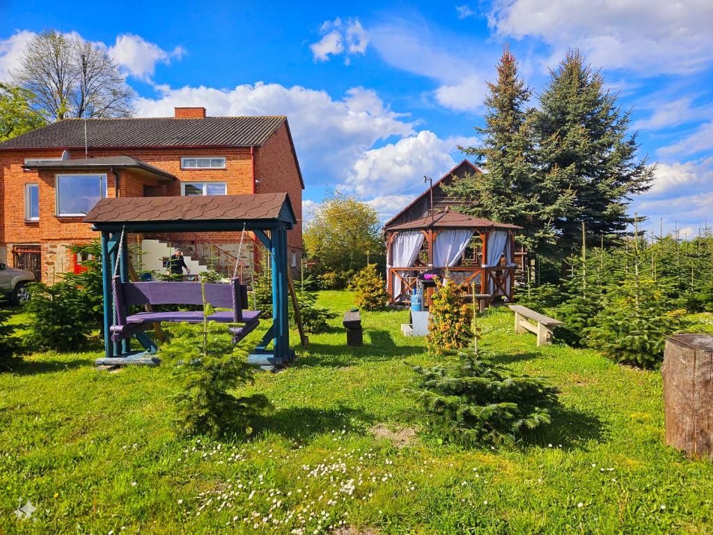 a house with a yard with a gazebo at Sielski Dom (dotrzesz bez auta!) 