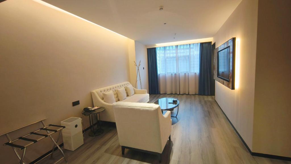 TV a/nebo společenská místnost v ubytování Shenzhen Lido Hotel