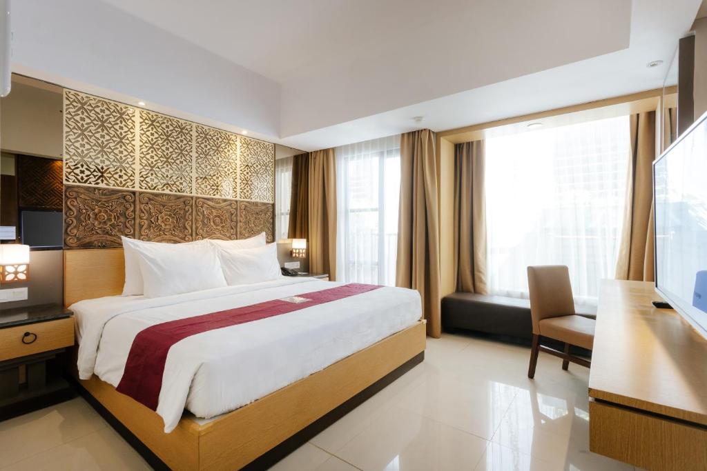 Postel nebo postele na pokoji v ubytování Horison Ultima Seminyak Bali - CHSE Certified