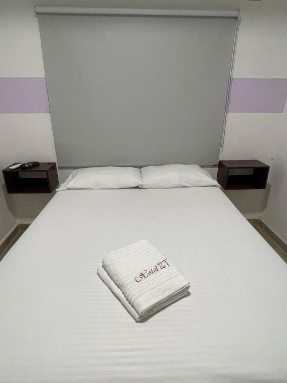 Postel nebo postele na pokoji v ubytování Hotel ZT