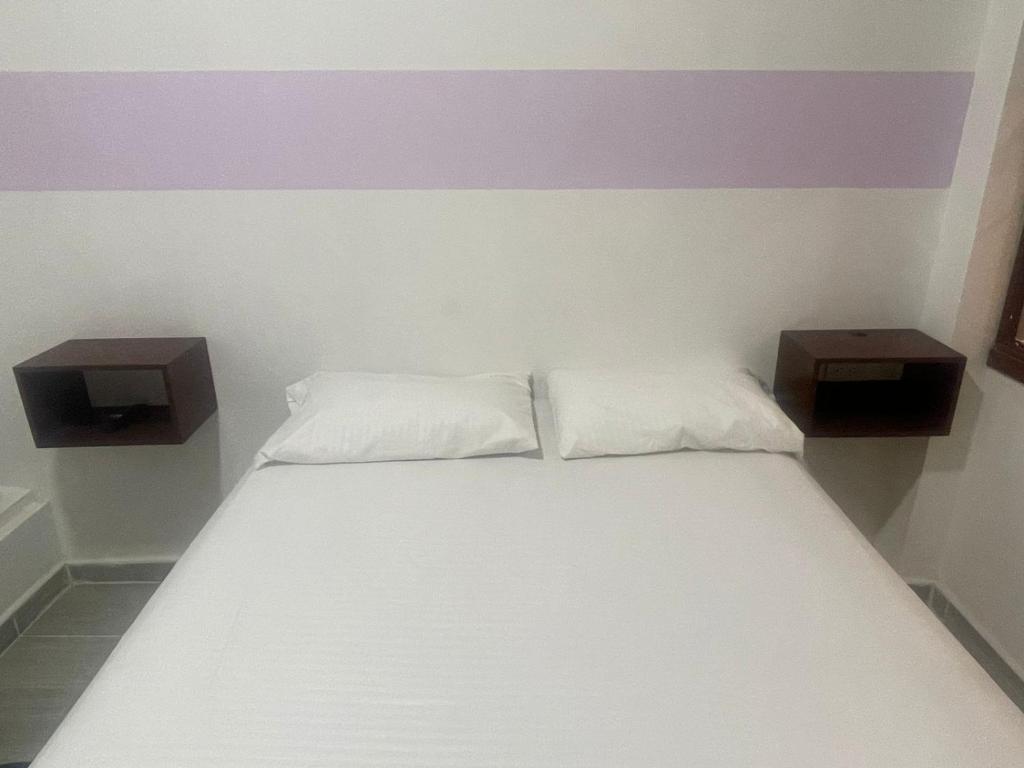 Postel nebo postele na pokoji v ubytování Hotel ZT