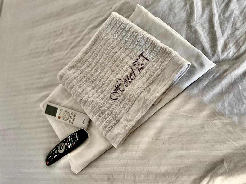 Postel nebo postele na pokoji v ubytování Hotel ZT
