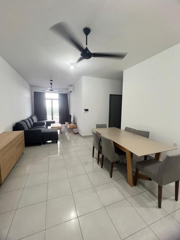 a living room with a table and a couch at 75 Suite (Tower B) in Papar