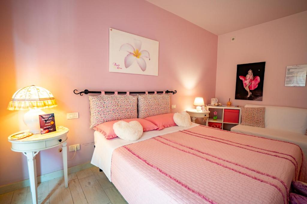 Postel nebo postele na pokoji v ubytování Petali Rosa