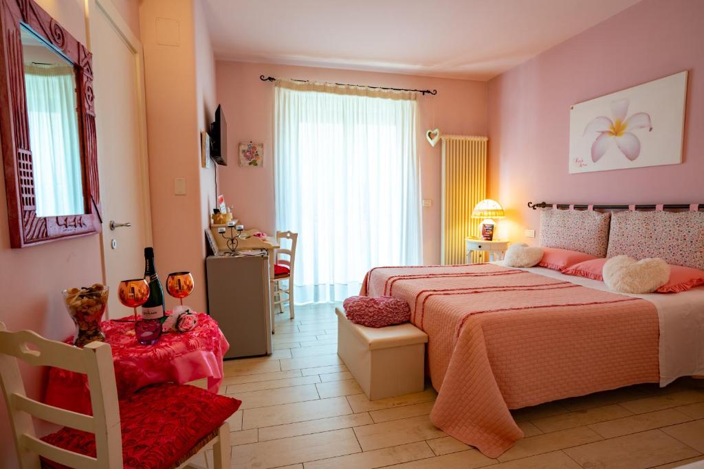 Postel nebo postele na pokoji v ubytování Petali Rosa