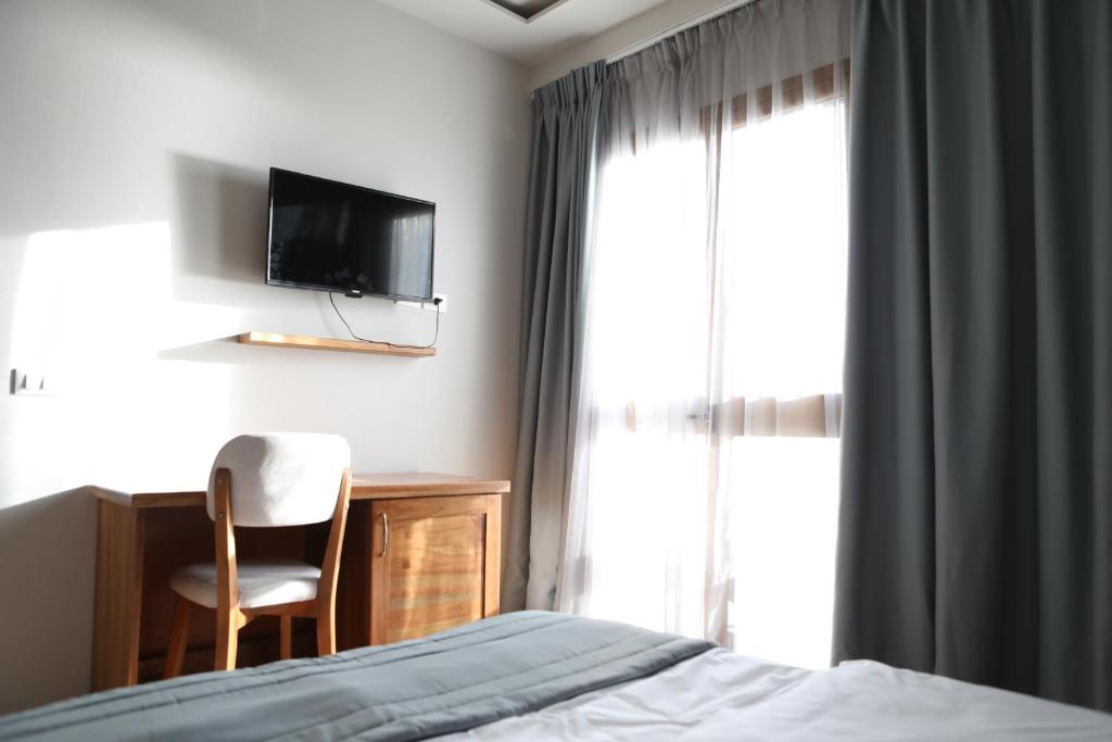 Postel nebo postele na pokoji v ubytování Doko Hotel
