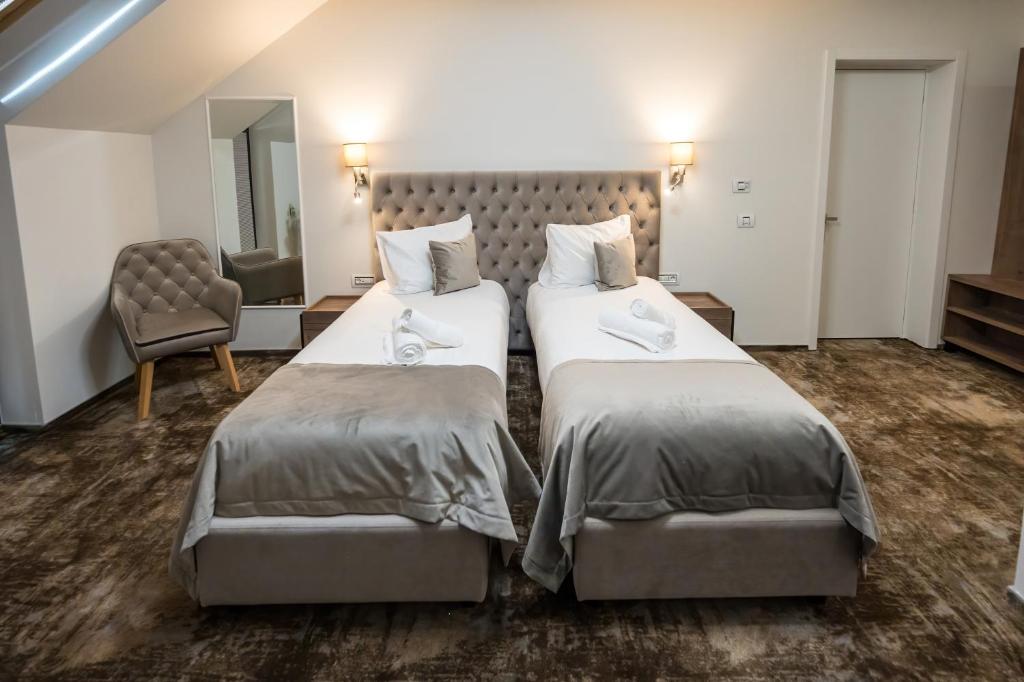 Postel nebo postele na pokoji v ubytování ALIVE HOTEL