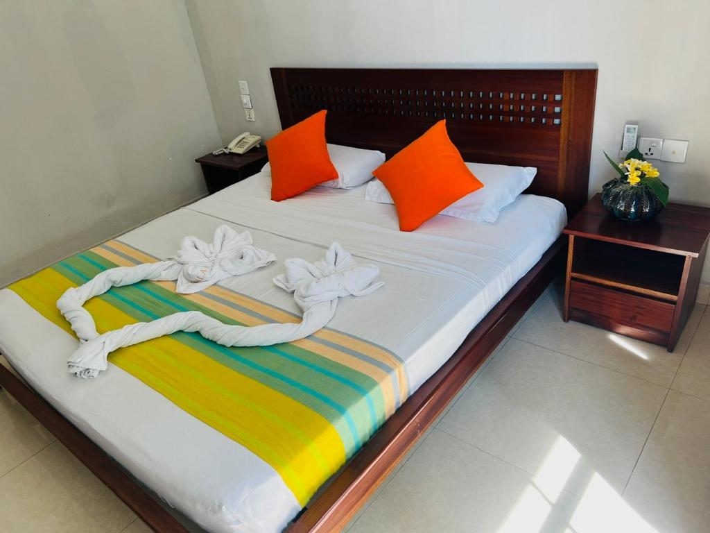 Postel nebo postele na pokoji v ubytování Lafala Hotel & Service Apartment