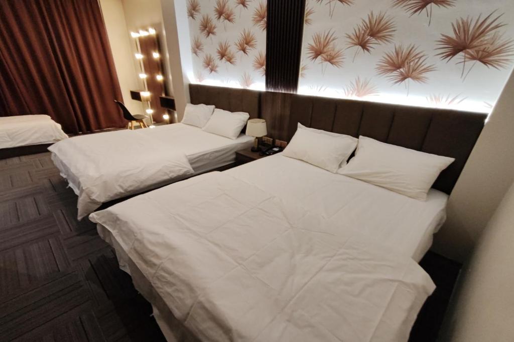 Postel nebo postele na pokoji v ubytování Casa Colney Hotel Ipoh