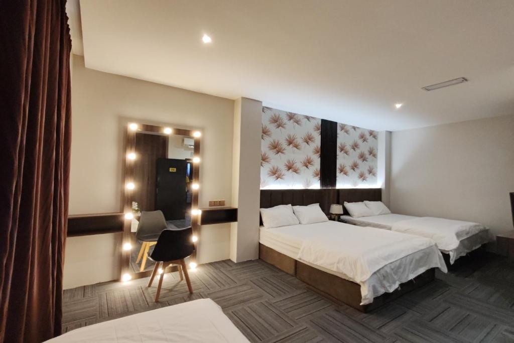 Postel nebo postele na pokoji v ubytování Casa Colney Hotel Ipoh