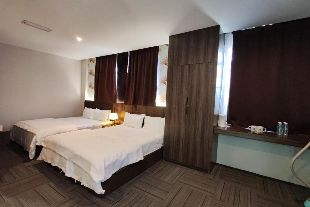 Postel nebo postele na pokoji v ubytování Casa Colney Hotel Ipoh
