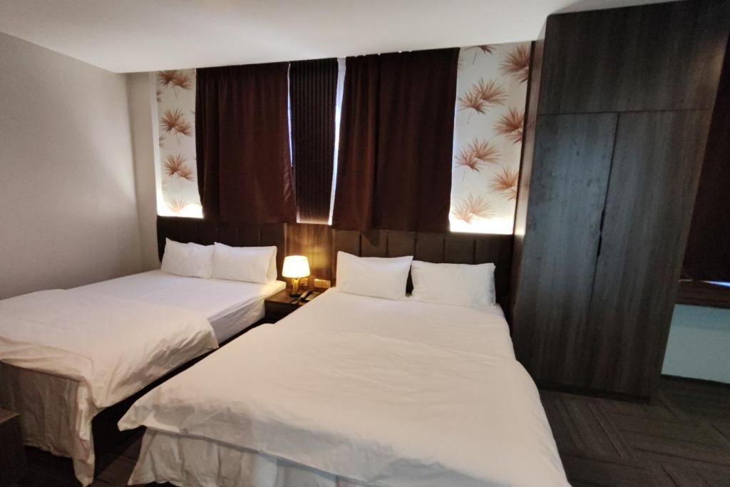Postel nebo postele na pokoji v ubytování Casa Colney Hotel Ipoh
