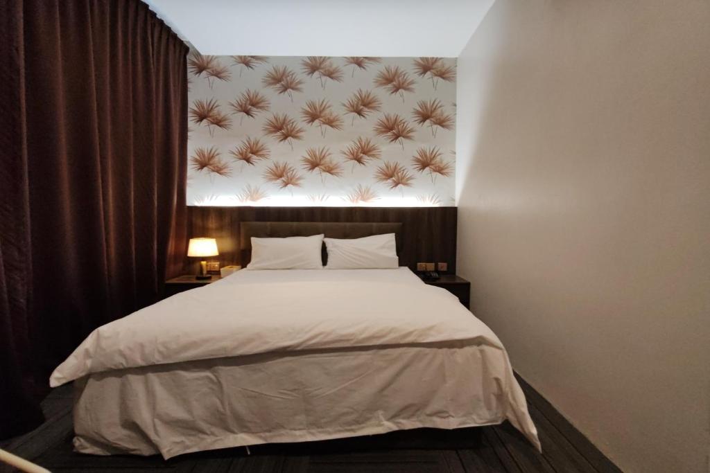 Postel nebo postele na pokoji v ubytování Casa Colney Hotel Ipoh