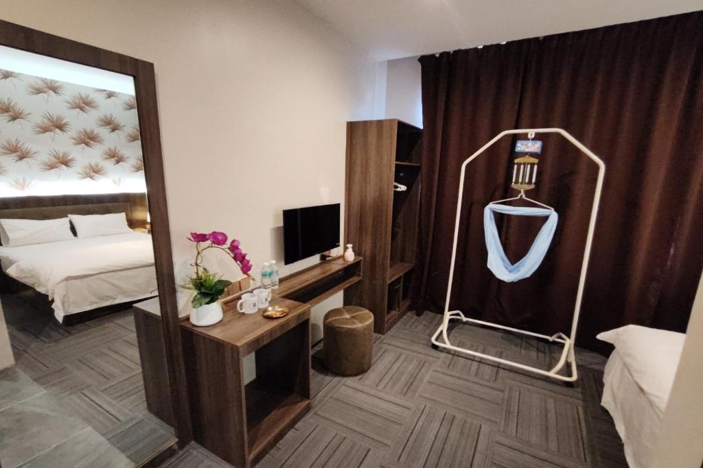 Postel nebo postele na pokoji v ubytování Casa Colney Hotel Ipoh