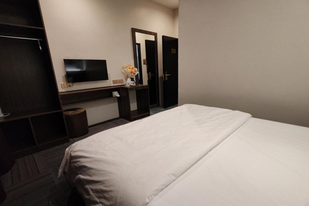 Postel nebo postele na pokoji v ubytování Casa Colney Hotel Ipoh