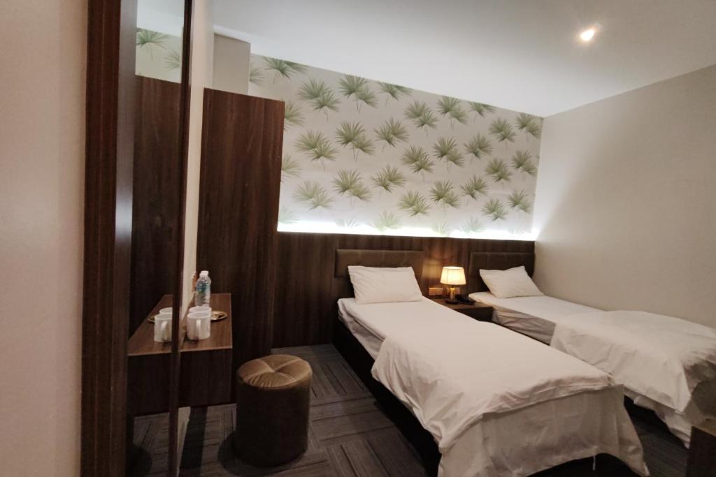 Postel nebo postele na pokoji v ubytování Casa Colney Hotel Ipoh