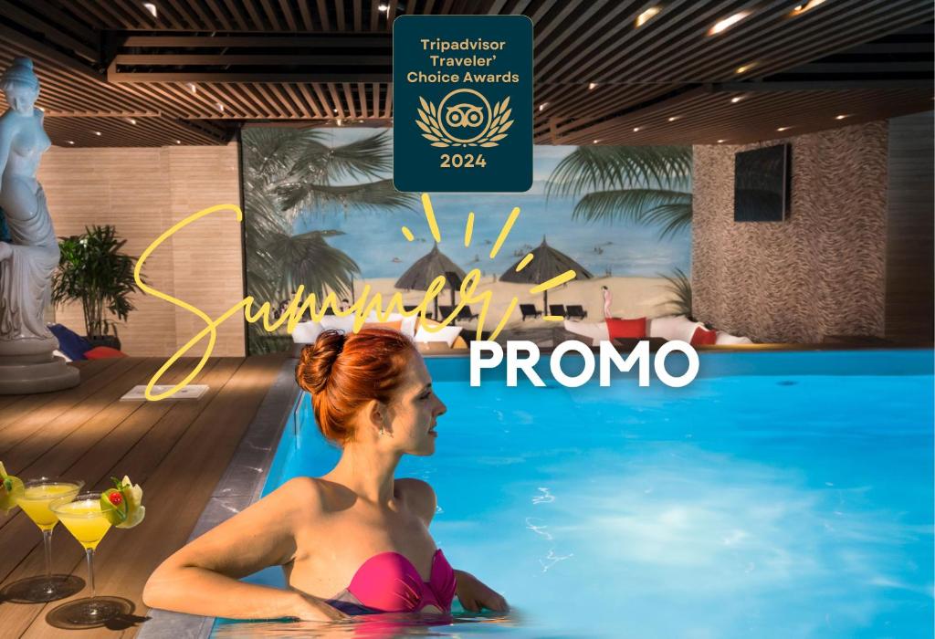 eine Titelseite einer Frau in einem Schwimmbad in der Unterkunft Harmony Saigon Hotel & Spa in Ho-Chi-Minh-Stadt