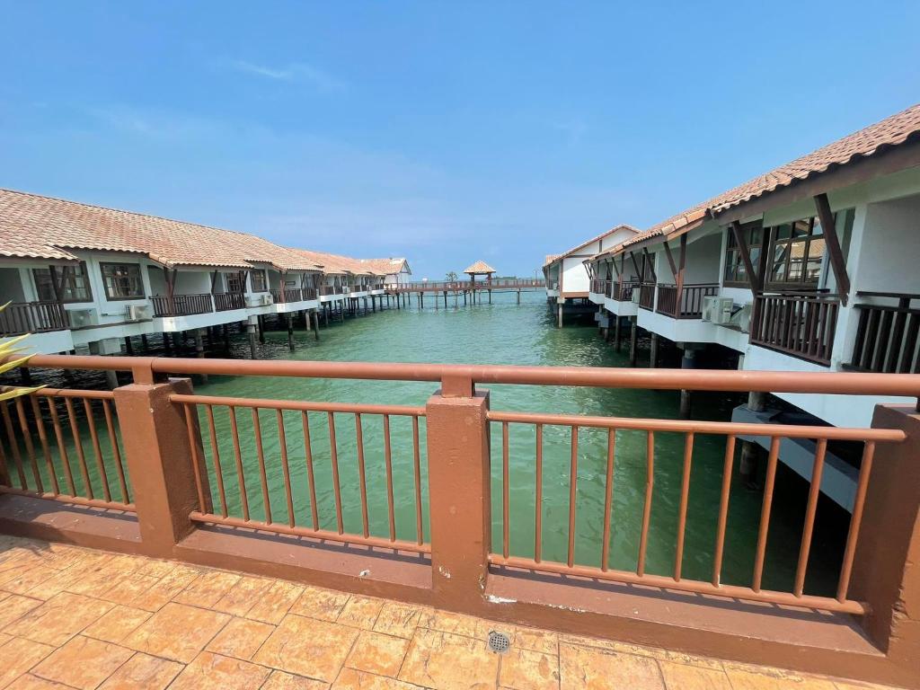 a view from a balcony of a resort on the water at Cuti-cuti port dickson water chalet in Port Dickson