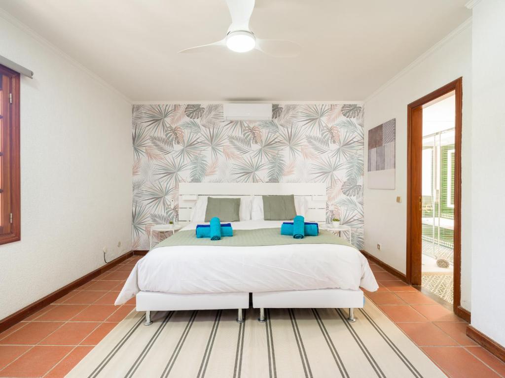 Łóżko lub łóżka w pokoju w obiekcie CASA GRAN CANARIA - Gran Canaria Stays