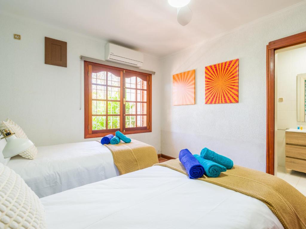 Łóżko lub łóżka w pokoju w obiekcie CASA GRAN CANARIA - Gran Canaria Stays