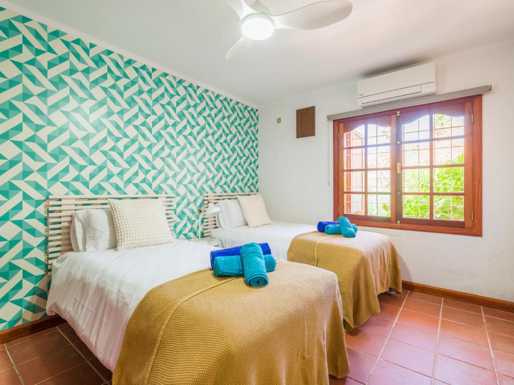 Łóżko lub łóżka w pokoju w obiekcie CASA GRAN CANARIA - Gran Canaria Stays