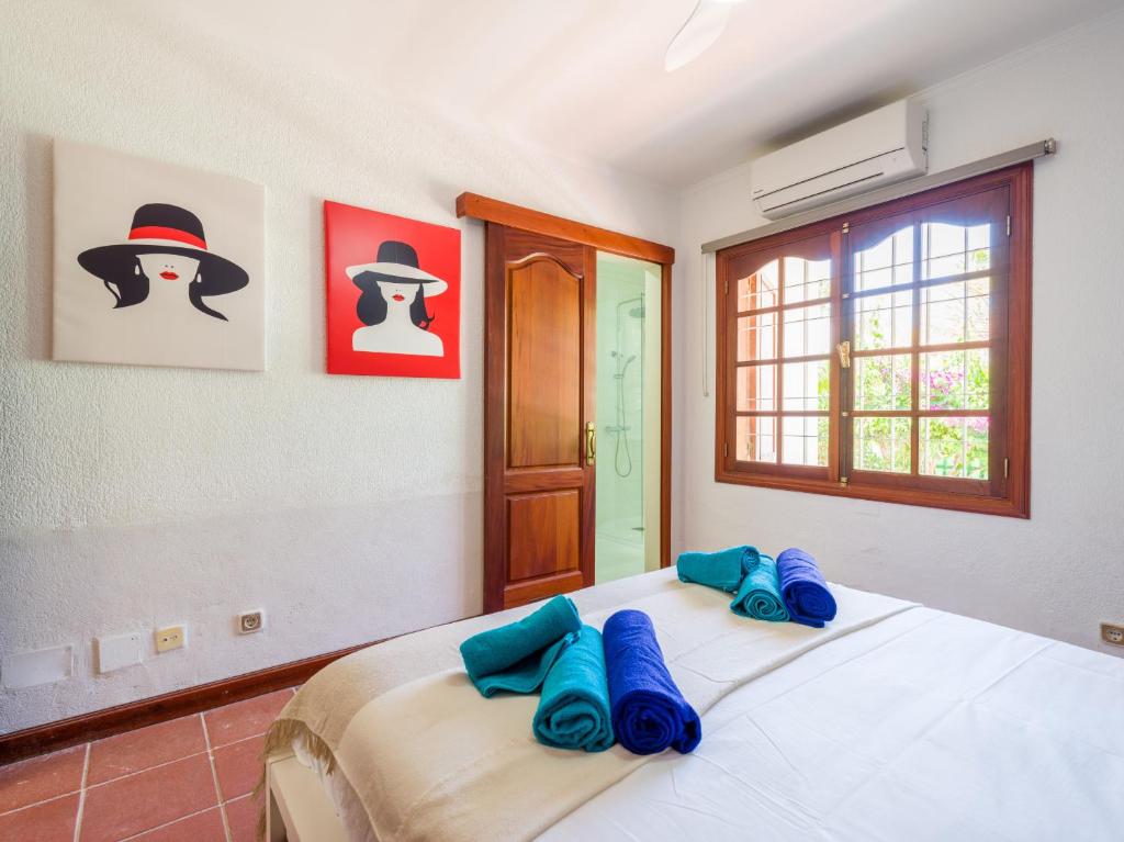 Łóżko lub łóżka w pokoju w obiekcie CASA GRAN CANARIA - Gran Canaria Stays