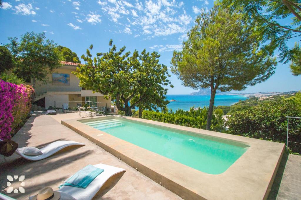 a swimming pool in the backyard of a house at Villa Ana Clara by Abahana Villas in Altea la Vieja